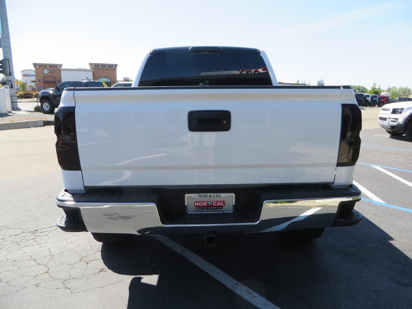 2018 White /BLACK Chevrolet Silverado 1500 LT (3GCPCREC7JG) with an 5.3L V8 OHV 16V engine, automatic transmission, located at 2630 Grass Valley Highway, Auburn, CA, 95603, (530) 508-5100, 38.937893, -121.095482 - Must see Pre Runner.... CST front lift spindals, Camburg UCA's, King Adjustable 2.5 Coil-overs, King 2.5 rear shocks, 35" Toyo RT Trail tires, 17" Method Race wheels, MZ front skid plate, G2 rear differntail cover, Full size bed mounted spare tire, Black Vinyl roof wrap, smoke tail lights and 3rd br - Photo#5